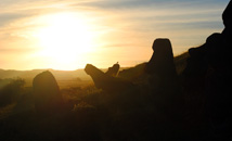 Silhouette of moai statues at sunset in volcano quarry and statue factory Rano Raraku