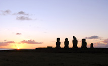 Sunset at Tahai with moai statues silhouette