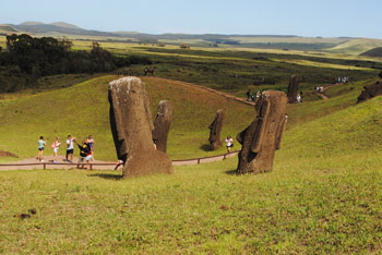 Tourists taking photos of Easter Island heads.