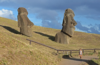 Boy walking among Rano Raraku moai statues.
