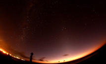 Wide shot of starry sky above Hanga Roa and Tahai Milky Way at Rapa Nui (Easter Island)