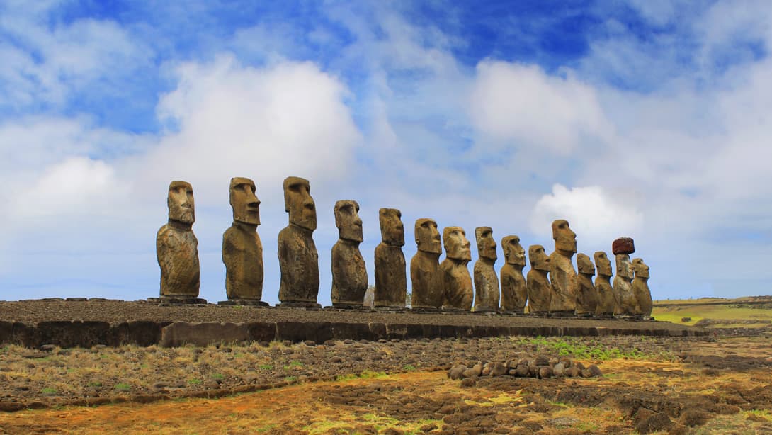 The 15 statues of Ahu Tongariki with burnt grass, Easter Island (Rapa Nui)