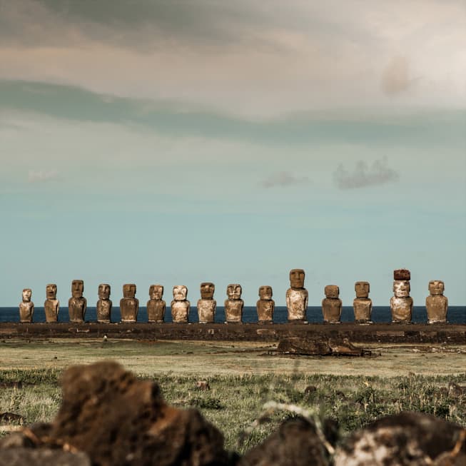 Front of 15 moai statues of Ahu Tongariki with ocean in background