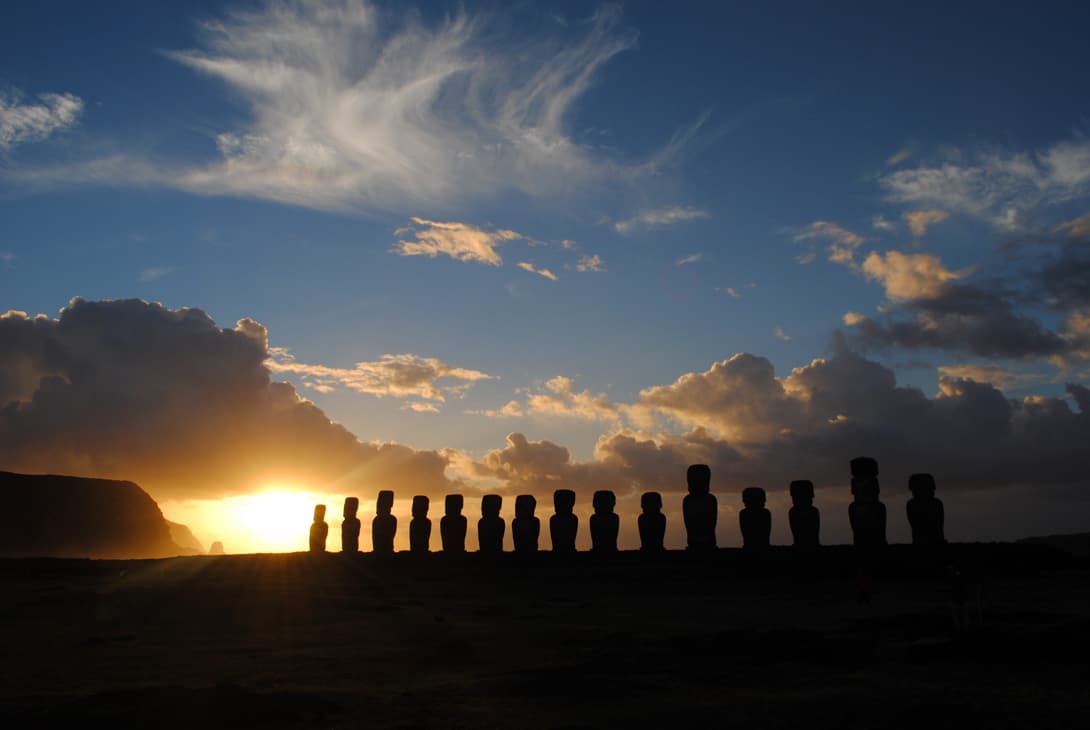 Silhouette of moai statues at Ahu Tongariki at sunrise