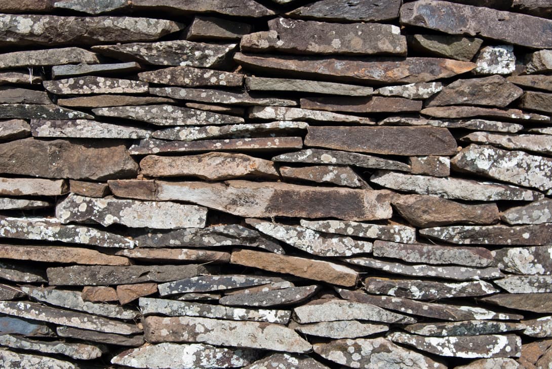 Stone texture of basalt slab hare keho houses at Orongo