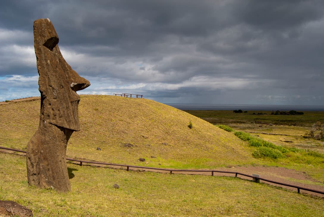 Easter Island moai statue head Piro-Piro with incoming rain clouds