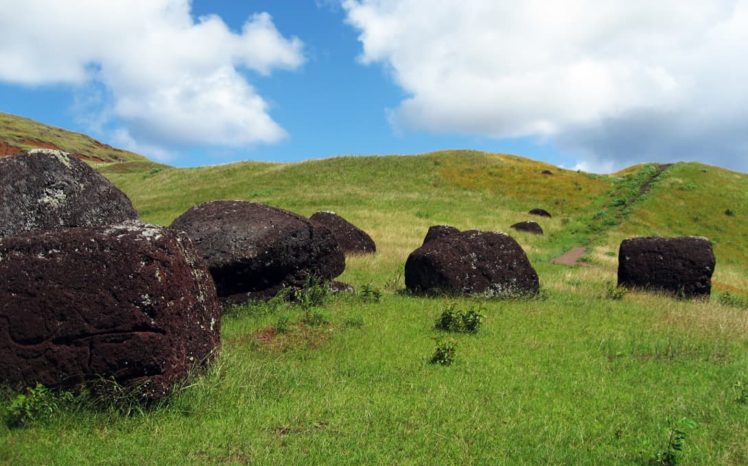 Moai statue topknots of red scoria stone at Puna Pau