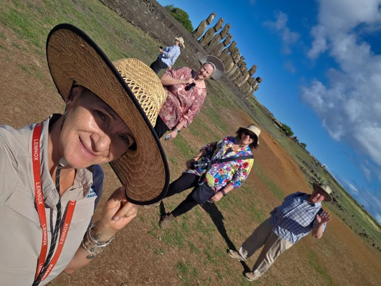 Easter Island Travel local guide with travelers during a tour at Ahu Tongariki.