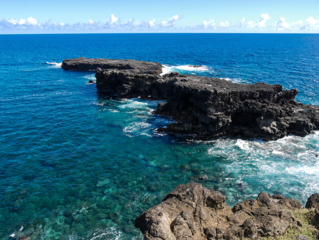 View of Motu Ko Hepo and Motu Tautara from the right window of Ana Kakenga, one of the most photographed landscapes on Rapa Nui's northwestern coast.