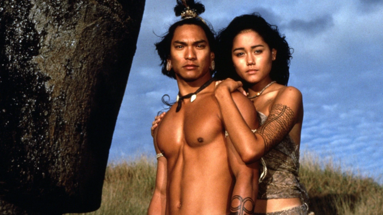 Lead actors from the movie Rapa Nui, produced by Kevin Costner, embracing during the 1994 filming.