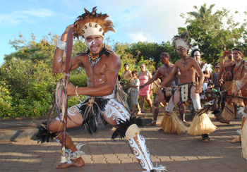 Native Rapa Nui men dancing at Tapati Rapa Nui festival parade.
