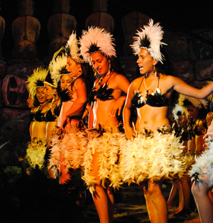 Rapa Nui girls dancing at the evening scene at Tapati Rapa Nui festival.