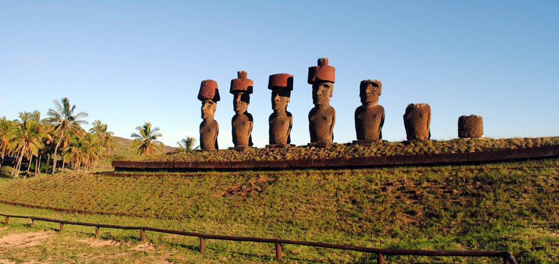 Moai Statues Of Ahu Nau Nau Wearing Topknots Near Anakena 