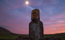 Mōai Ha'ere Ki Haho or Traveling Moai by Ahu Tongariki under full moon at sunrise at Rapa Nui (Easter Island)