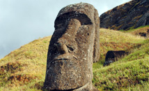 Single moai statue during sunrise at volcano Rano Raraku