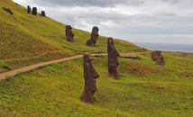 Moai statues in Rano Raraku quarry with cloudy sky