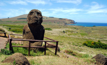 Kneeling moai statue at Rano Raraku with Ahu Tongariki