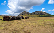 Pukao topknots at Tongariki with view of Rano Raraku