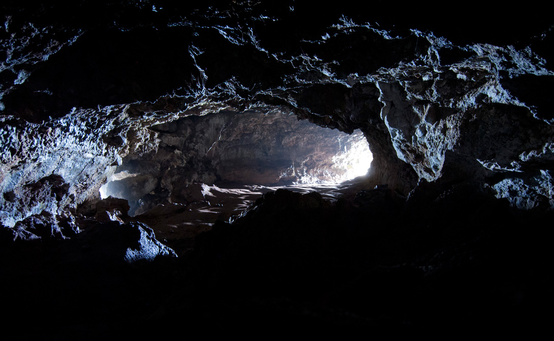 Light through the two ocean openings of Ana Kakenga lava cave