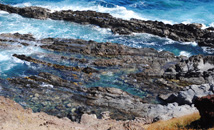 Colorful rocks and ocean in Vinapu area, Easter Island (Rapa Nui)