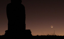 Crescent moon setting behind Ahu Huri a Urenga at Rapa Nui (Easter Island)