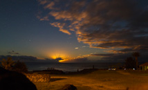 Sun setting behind clouds with stars, Tahai at Rapa Nui (Easter Island)