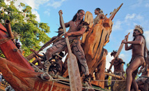 Rapa Nui man with bodypaint rowing at Tapati Rapa Nui festival parade, Easter Island