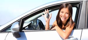 Woman with keys car hire rental